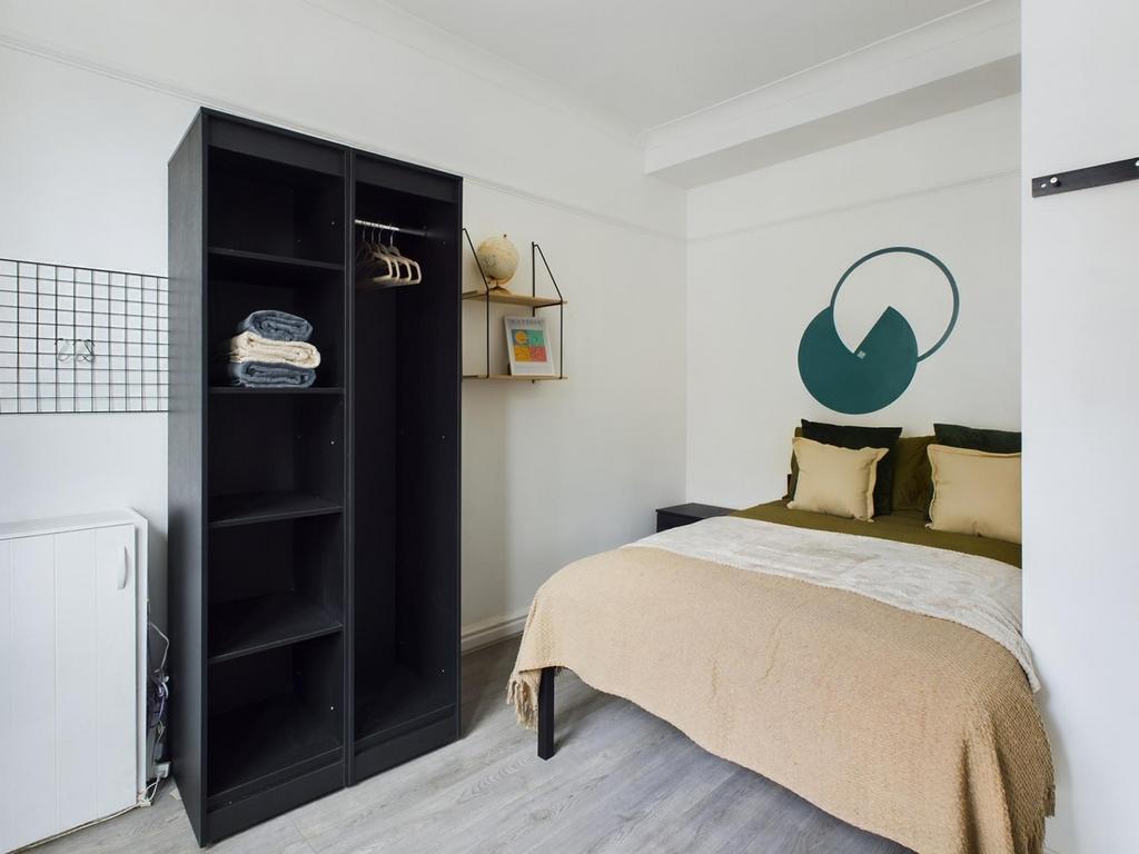 A stylish and well-organized double bedroom fea...