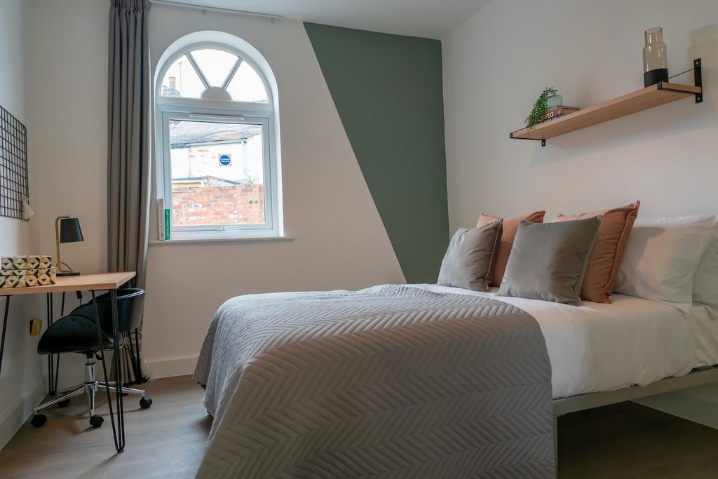 A stylish and inviting double bedroom with ampl...
