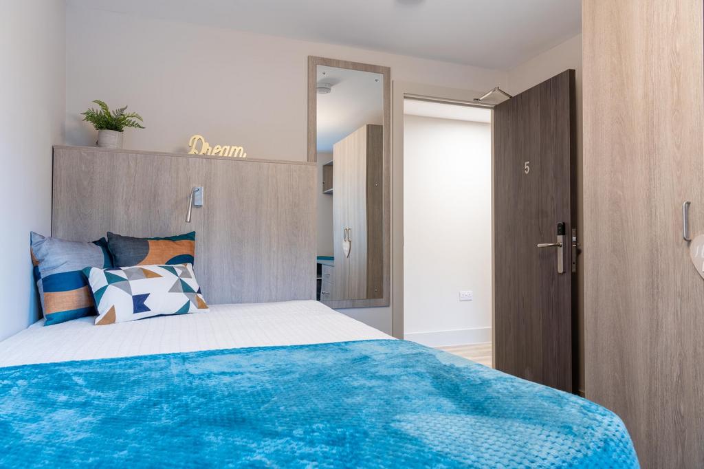 Bright and inviting double bedroom featuring a ...