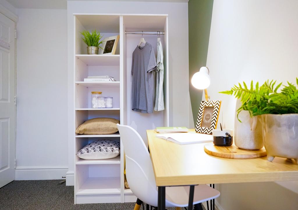 A stylish and organized small storage area with...