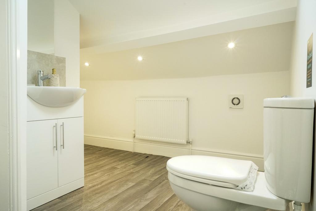 A well-maintained and bright bathroom featuring...