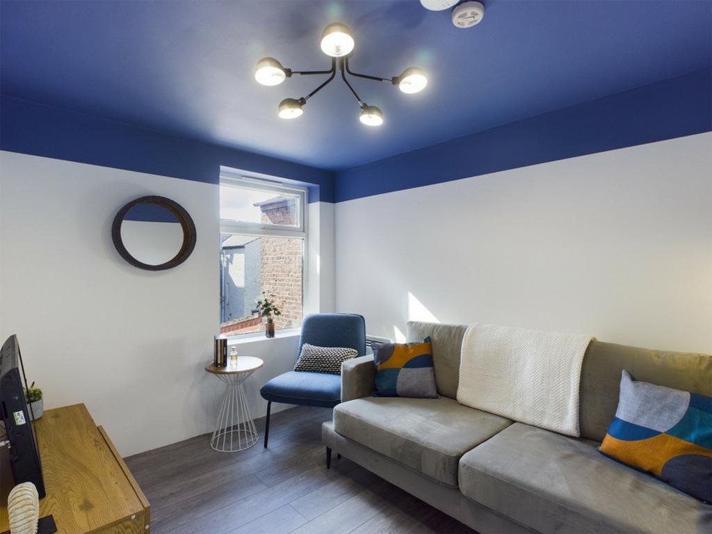 A bright and inviting living room featuring mod...