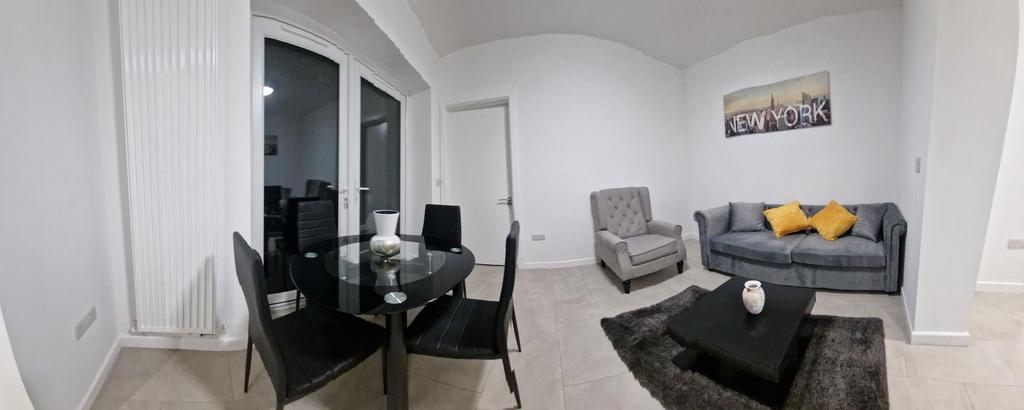 Bright, modern living room with a compact dinin...