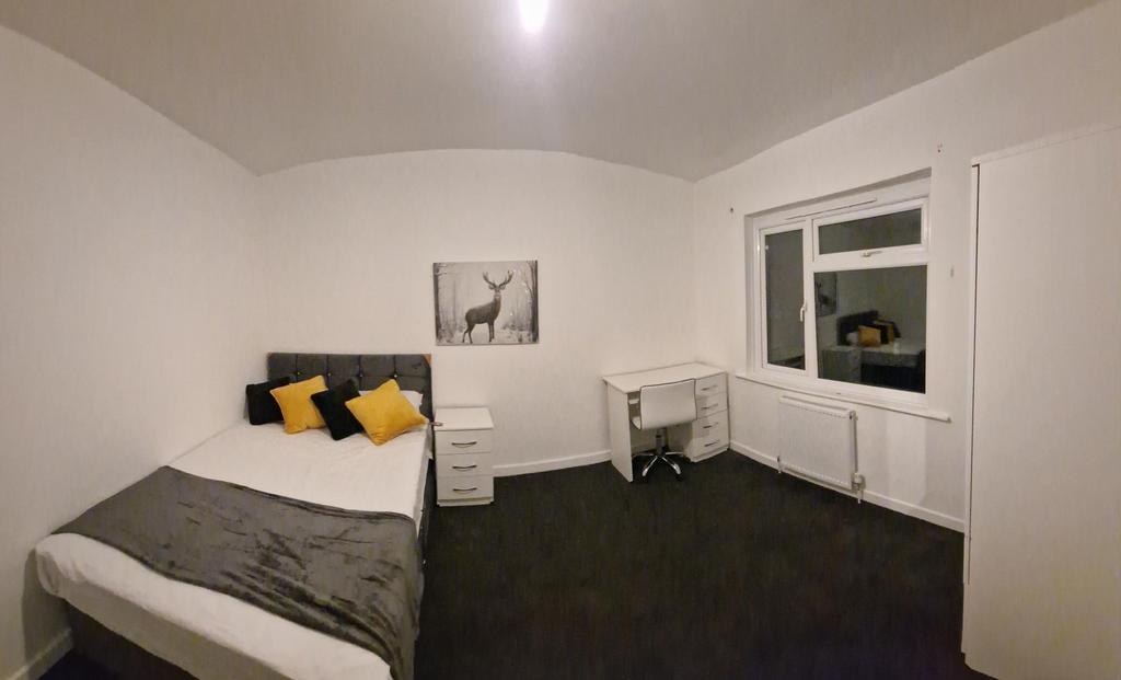 Bright, neatly presented bedroom with a double ...