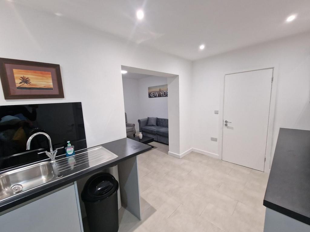 Bright modern kitchen with a stainless-steel si...