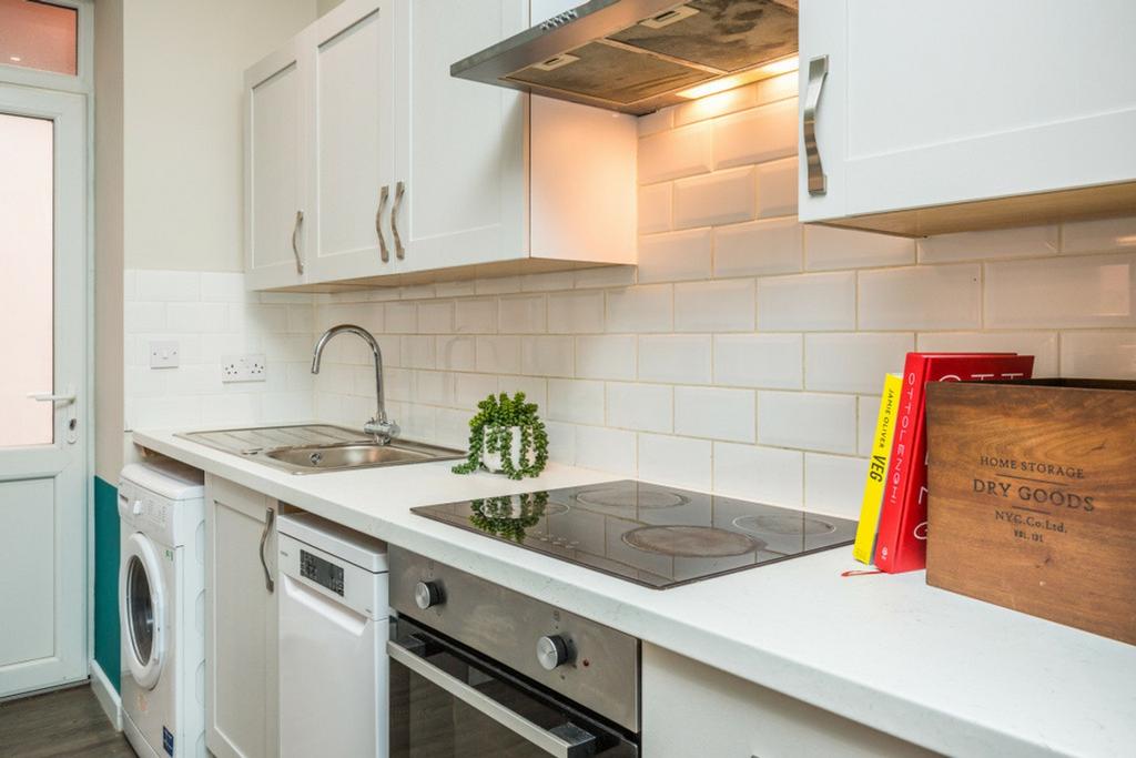 A modern and inviting kitchenette with ample st...