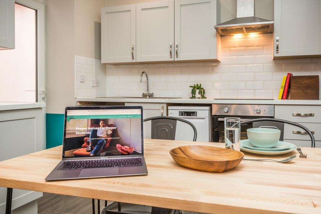 A bright and modern kitchenette featuring styli...