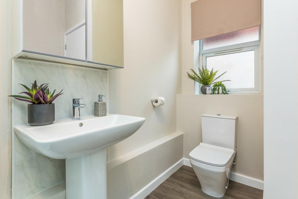 A modern and clean bathroom featuring stylish f...