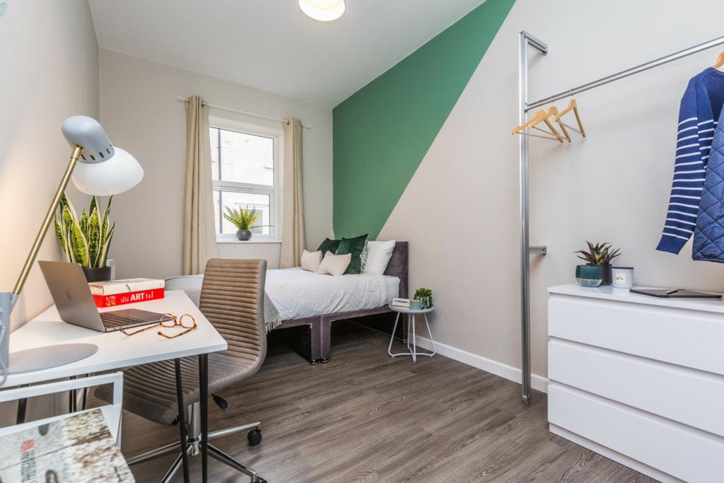 A stylish and well-lit double bedroom featuring...