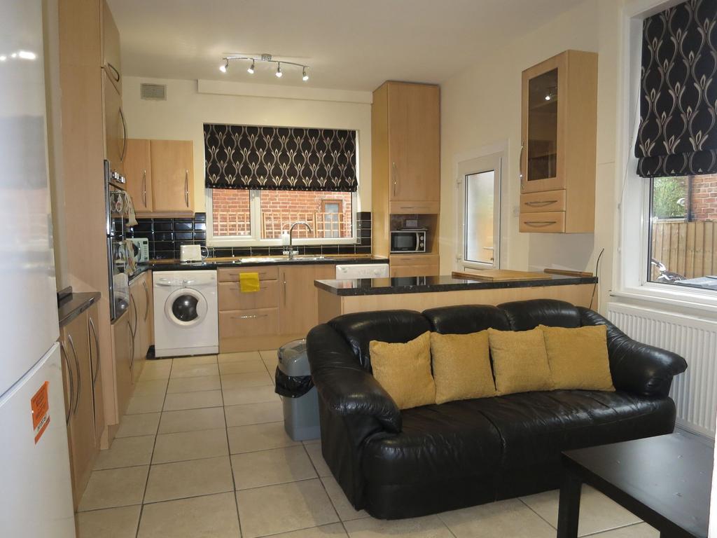 Bright open-plan kitchen and living area with a...