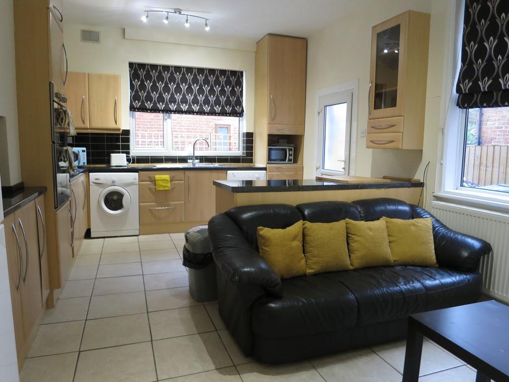 Bright open-plan living area with a modern fitt...