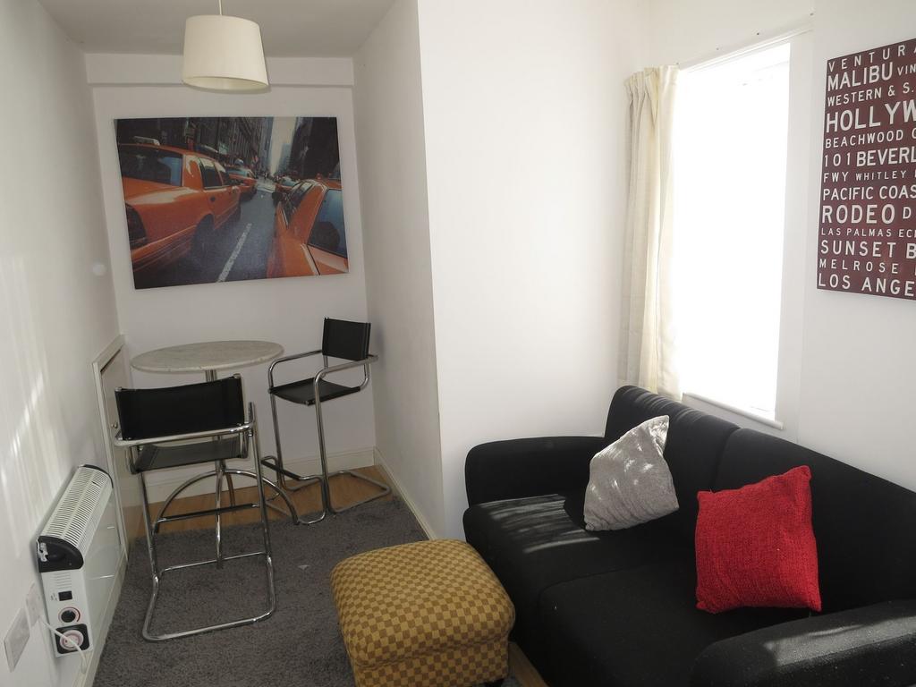 Bright, neatly presented living area with a com...