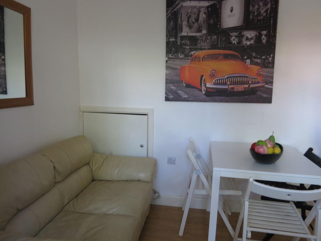 Bright, simply furnished living area with a com...