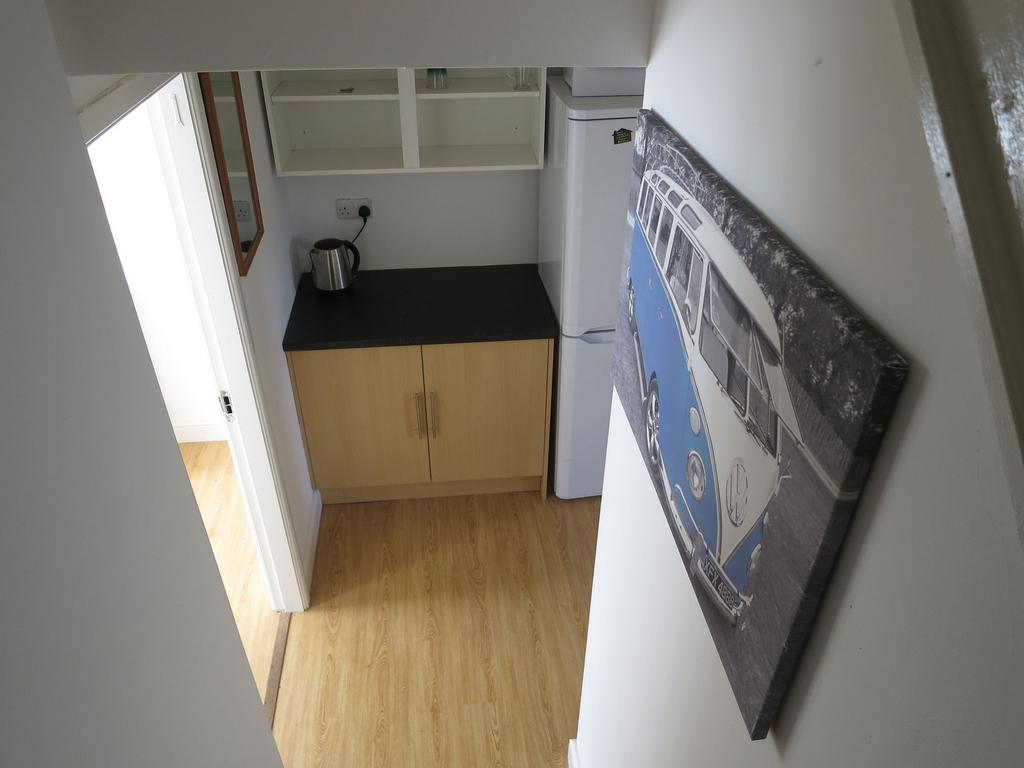Bright, well-kept landing and hallway with wood...