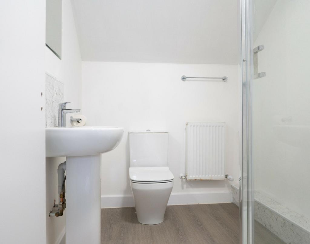 A clean and modern bathroom featuring a stylish...