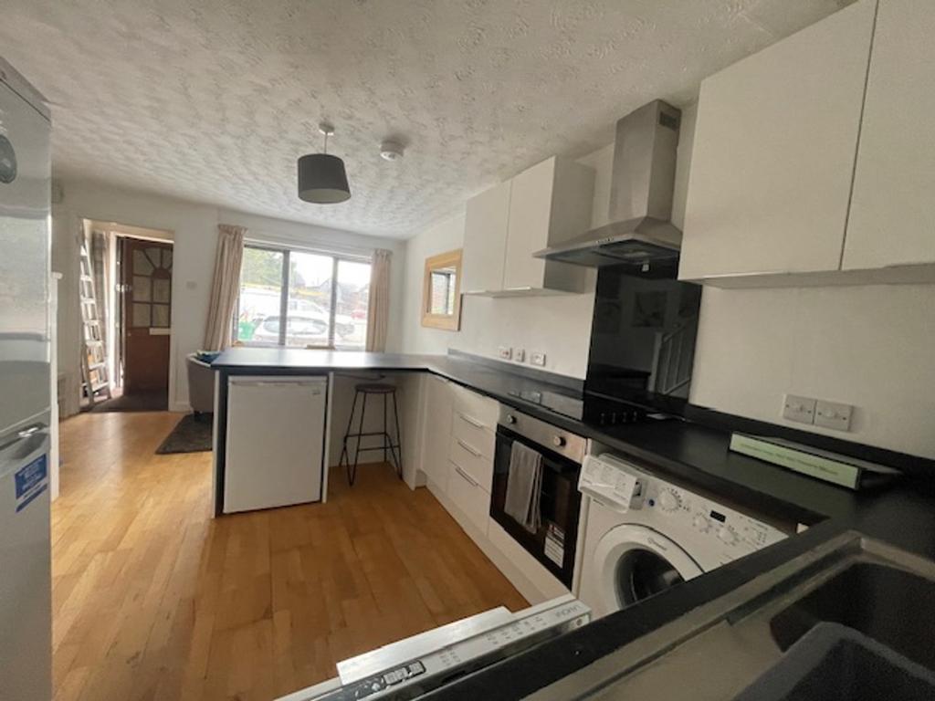 A spacious and modern kitchen, featuring ample ...