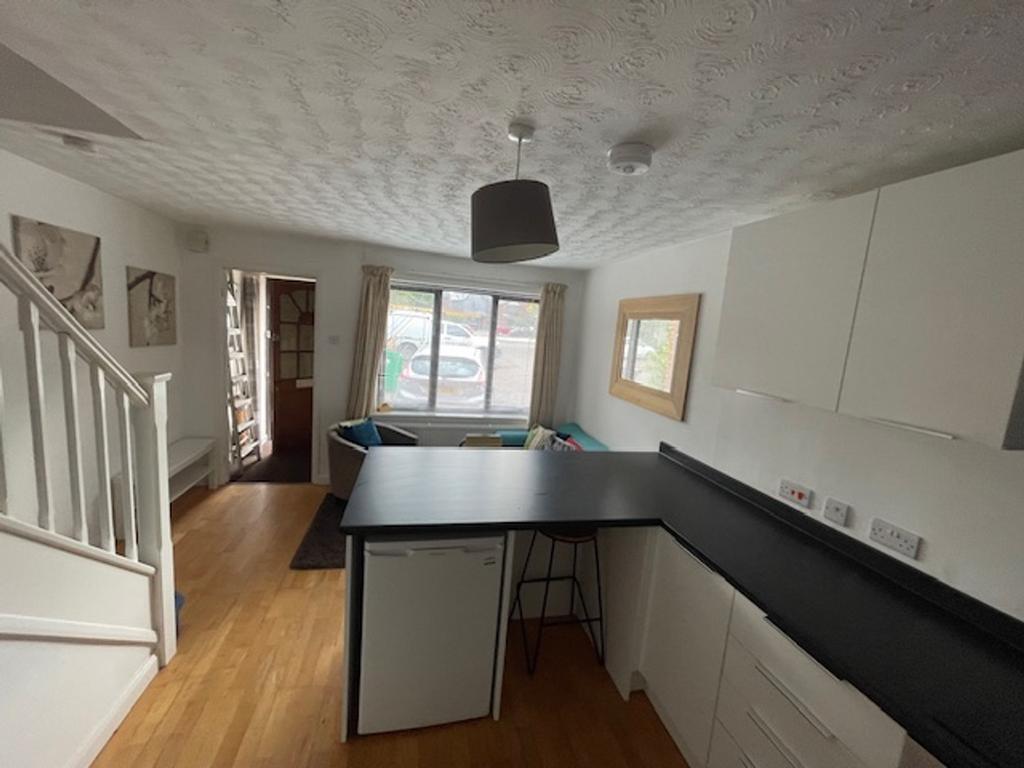 A bright and inviting kitchenette with modern f...