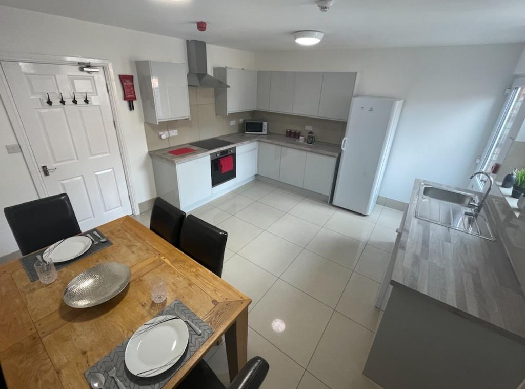 A spacious and well-lit kitchen featuring moder...