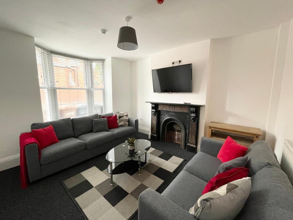 Bright, modern living room with two comfortable...
