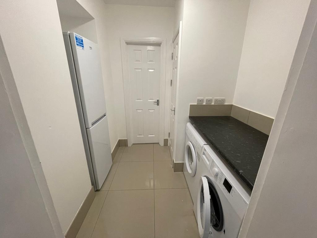 Bright, modern utility area with fitted counter...