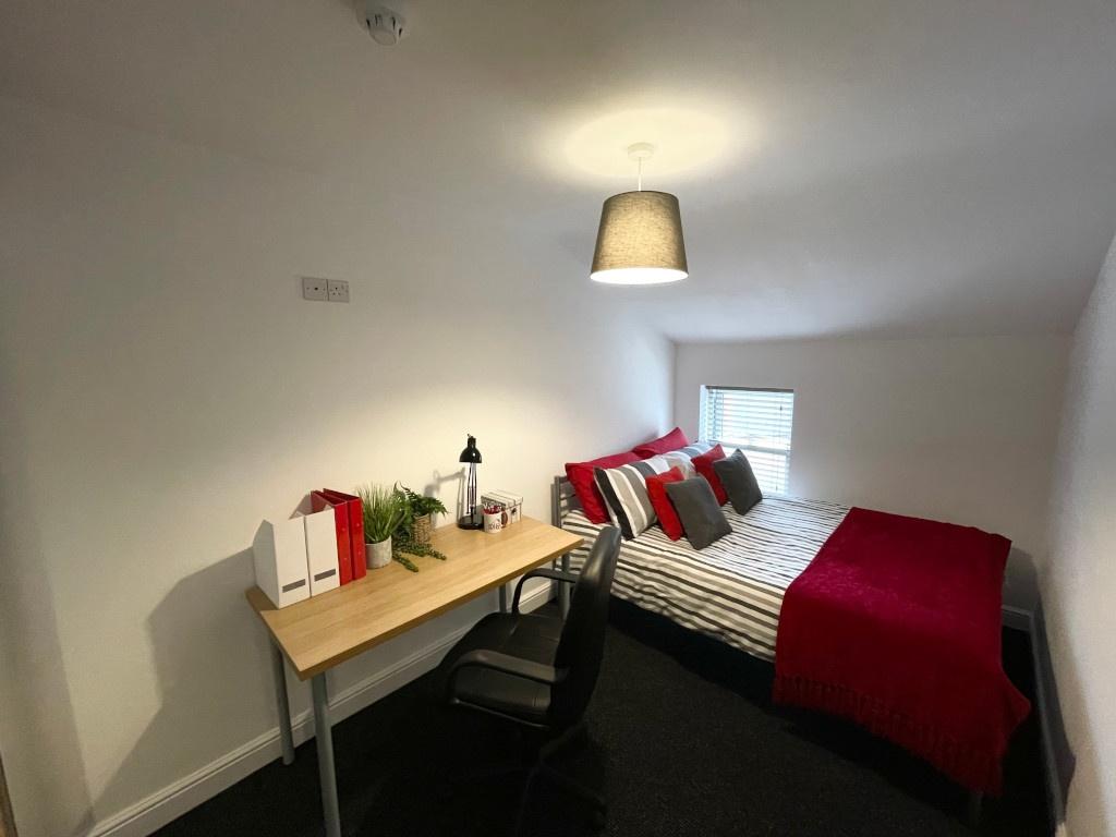 Bright, neatly presented bedroom with a double ...