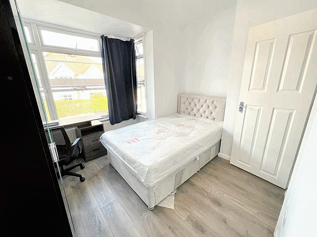 Bright, freshly decorated double bedroom with a...