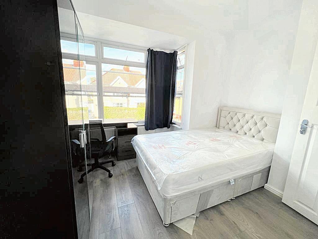 Bright, modern bedroom with a comfortable doubl...