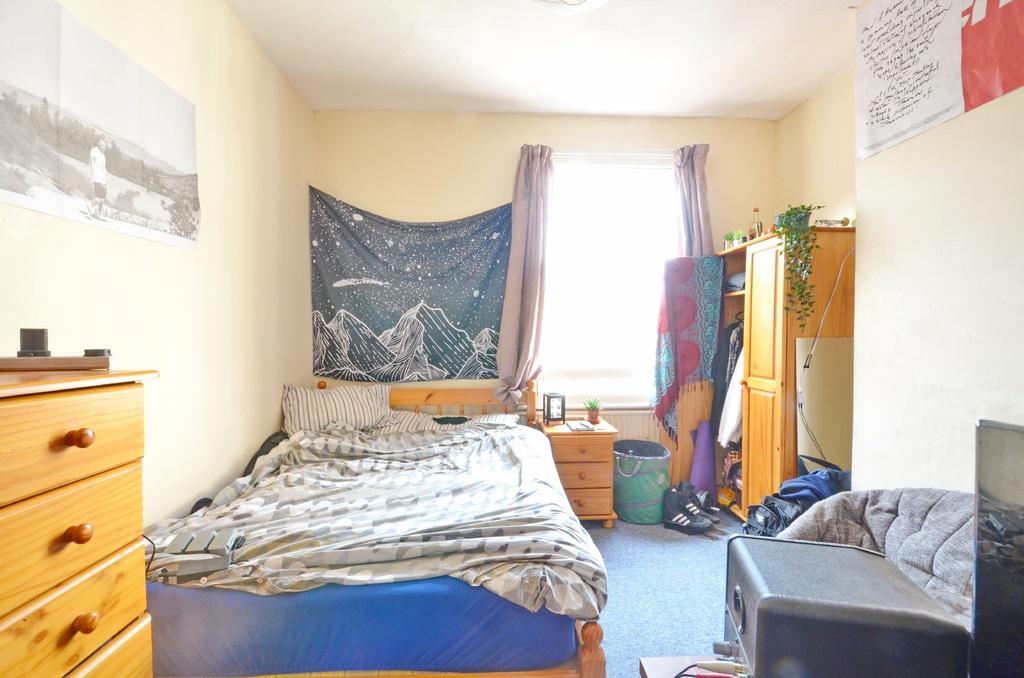 Bright, comfortable double bedroom with a large...