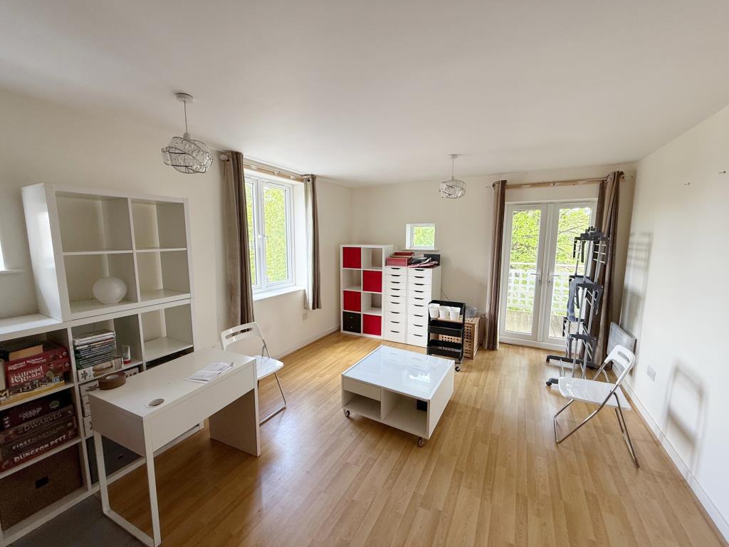 Living room with doors to balcony