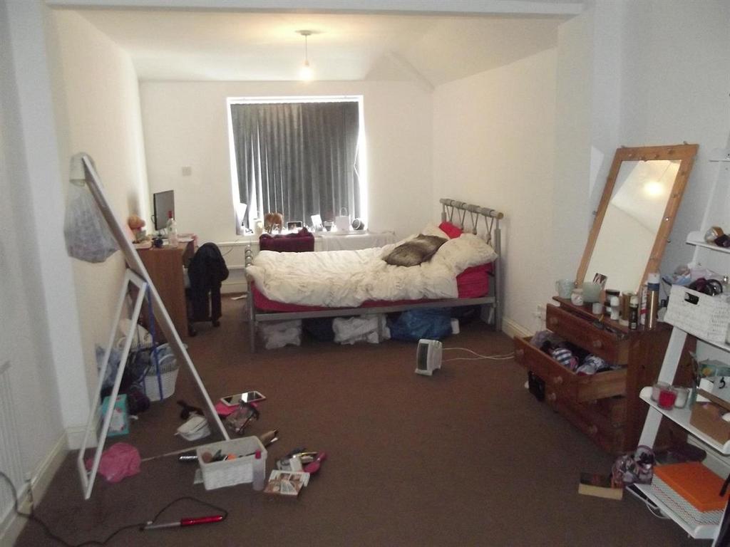 Bright bedroom with a double bed, full-length m...