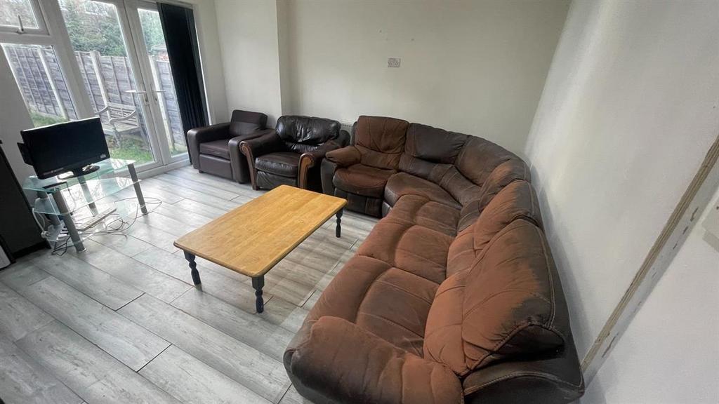 Spacious, well-lit living room with a large cor...