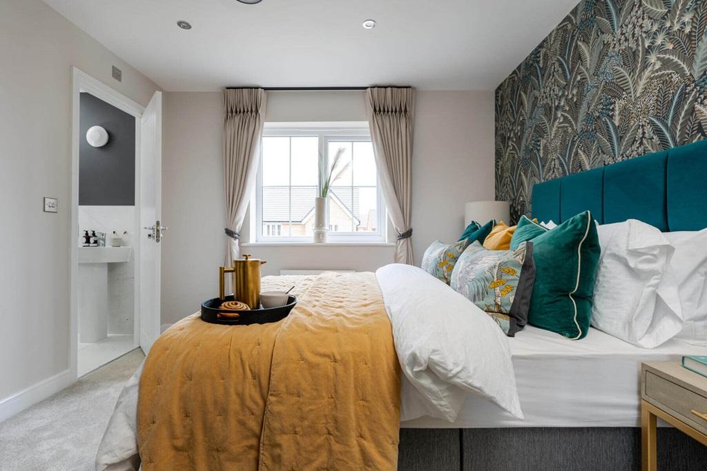 The main bedroom also hosts an en-suite,...