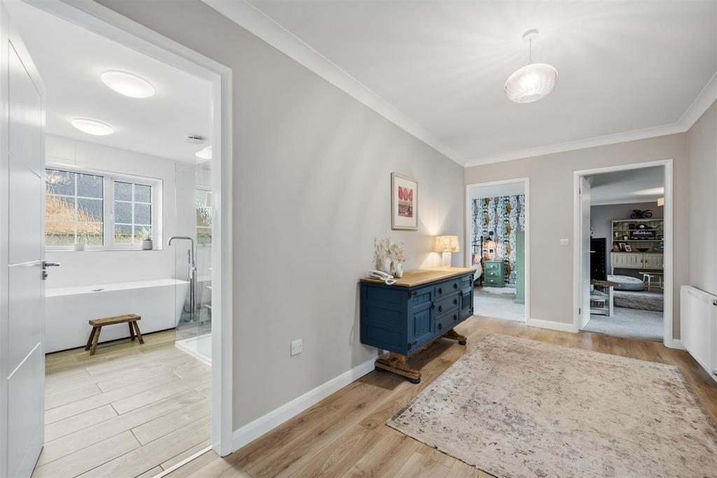 Inner Hallway towards Bedroom Three and Lounge.jpg