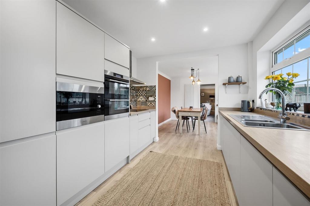 Kitchen to dining room and lounge.jpg