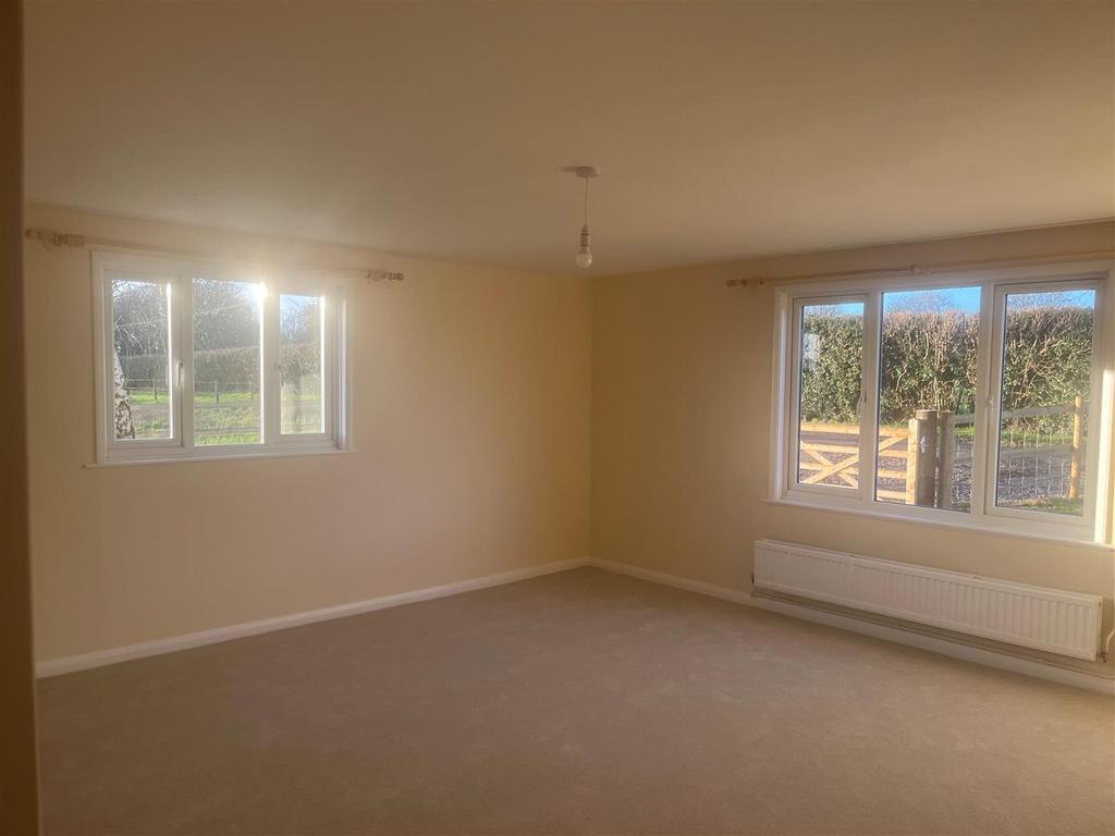 Sitting room with poles.jpg