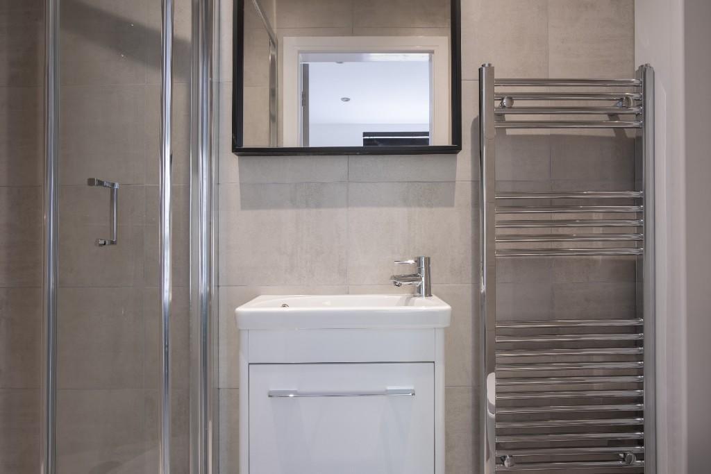 A modern, well-maintained bathroom featuring a ...