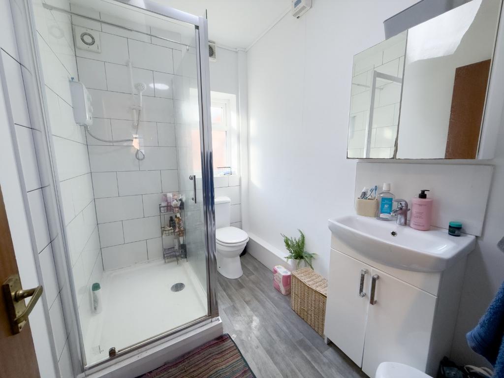 Bright, modern bathroom with a walk-in shower, ...