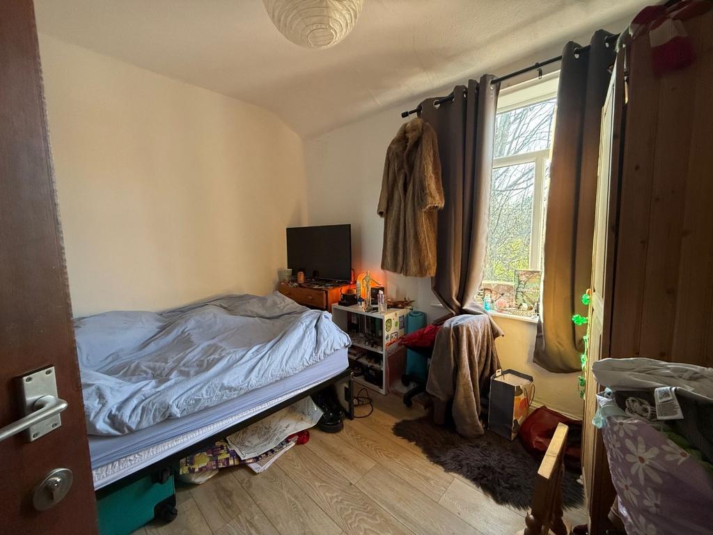 Well-lit double bedroom with a comfy bed, bedsi...