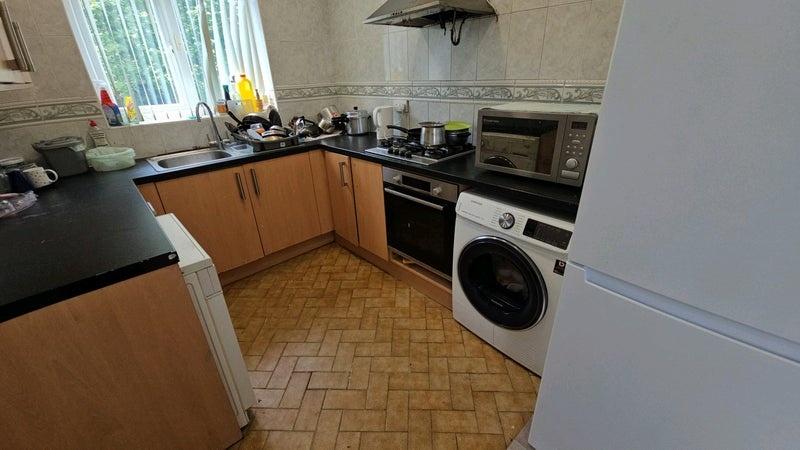Bright galley-style kitchen with good counter s...