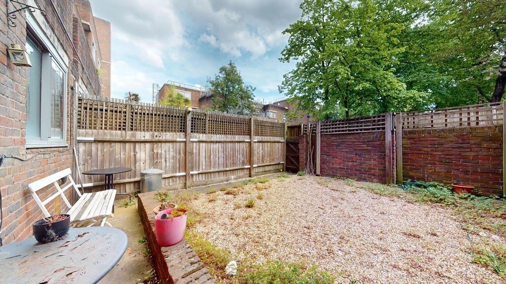 Private low-maintenance rear garden with gravel...