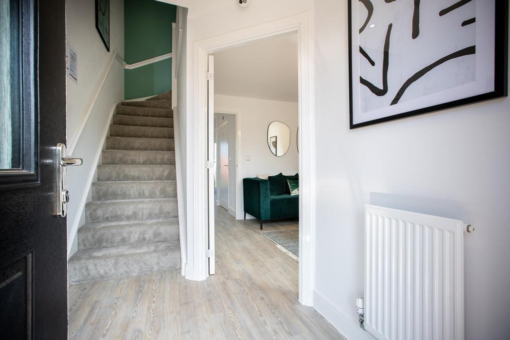 The hallway leads through to the spacious lounge