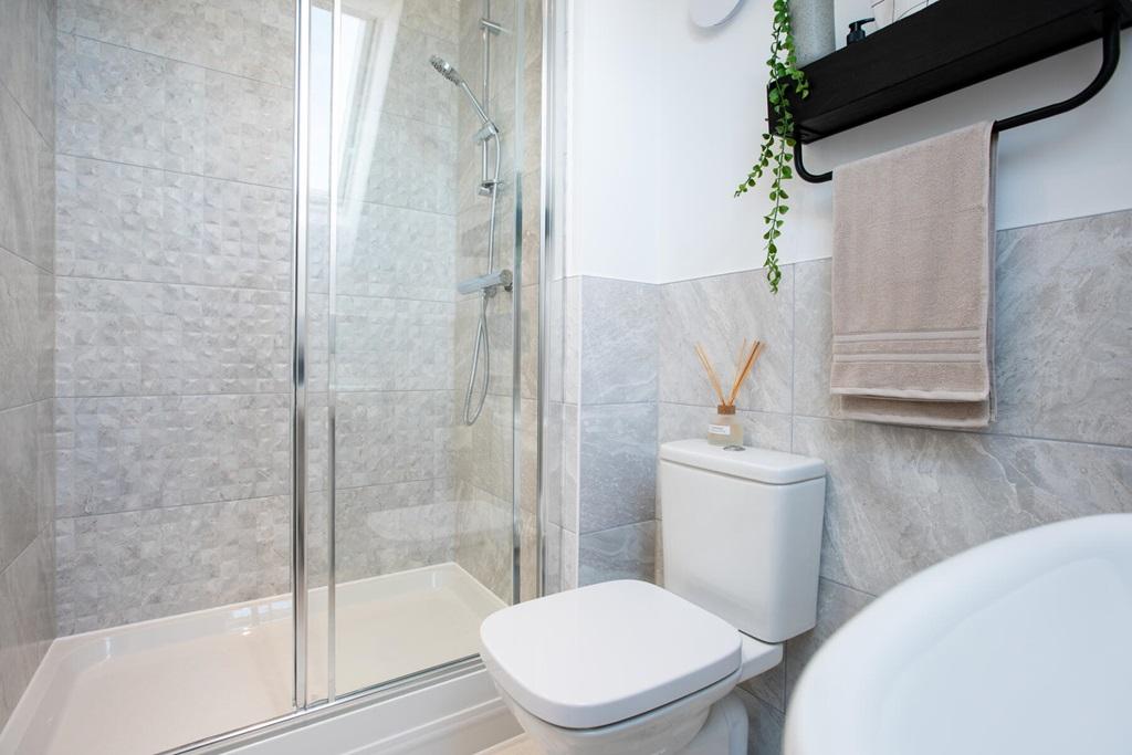 The main bedroom has its own en-suite shower room