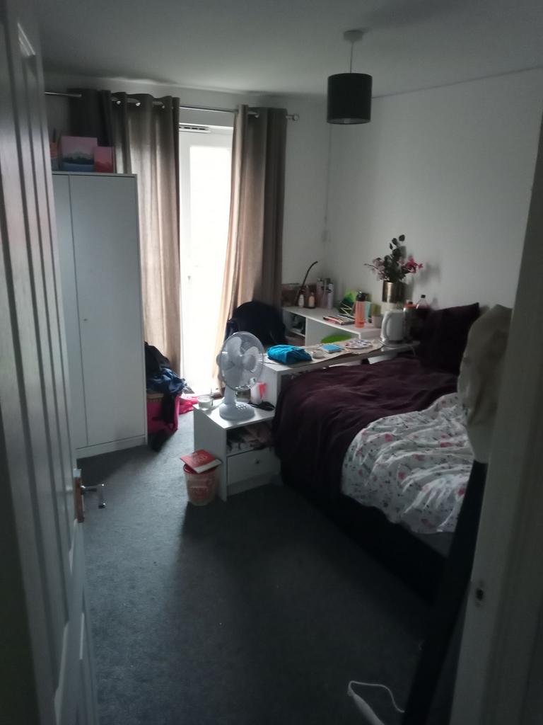 Cozy single bedroom with a comfortable bed, bed...