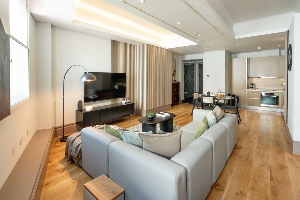 Bright, contemporary open-plan living area with...