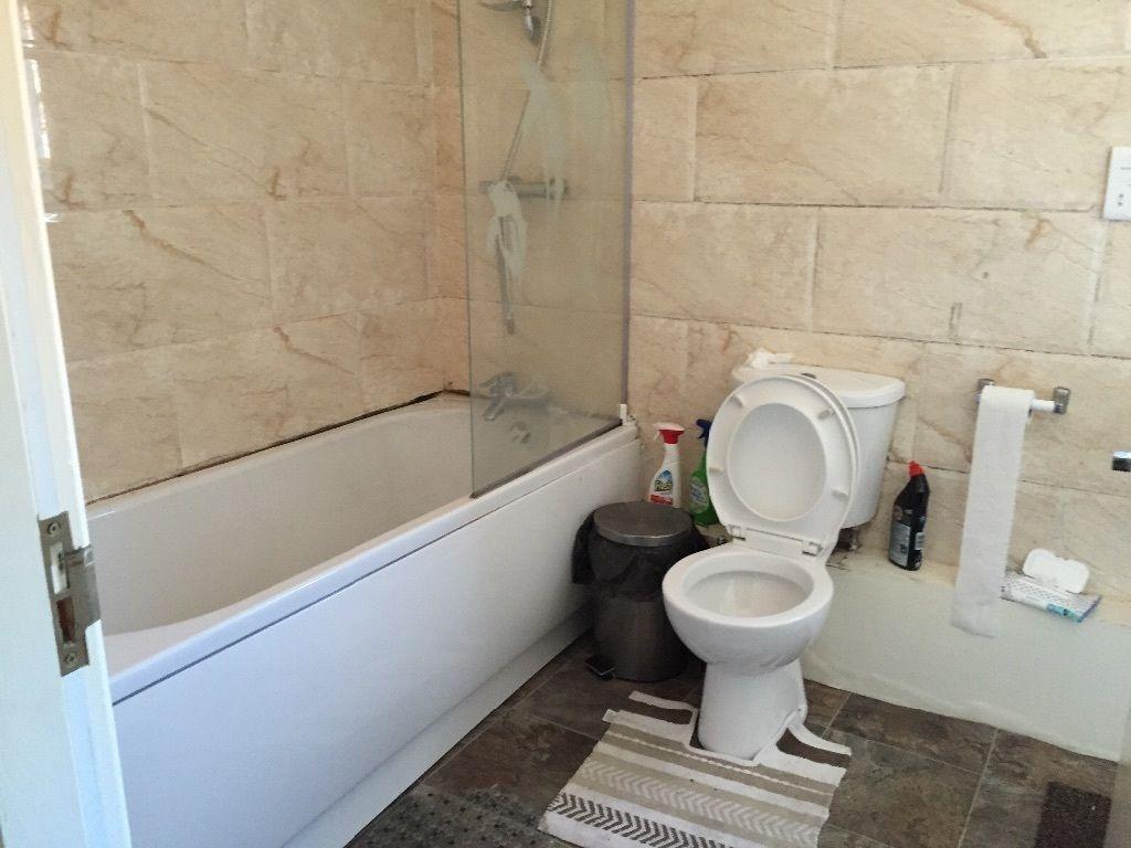 Modern bathroom featuring a spacious bathtub wi...