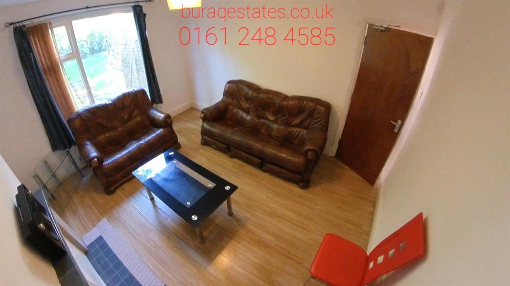 Bright furnished living room with two comfortab...