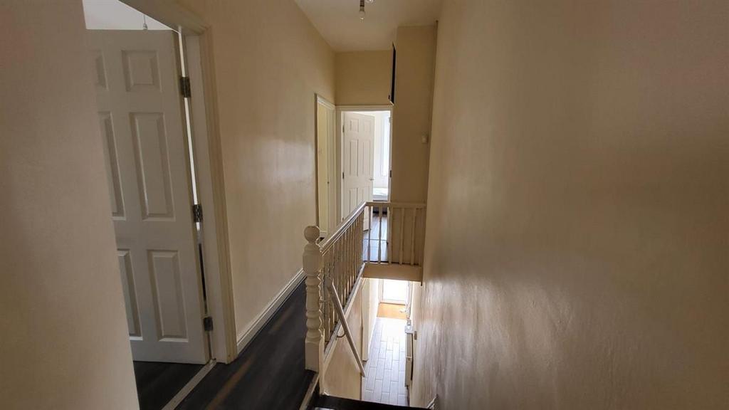 Bright first-floor landing with neutral walls, ...