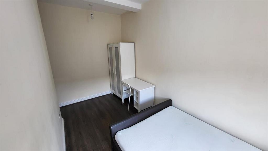 A small, clean bathroom with a visible toilet a...