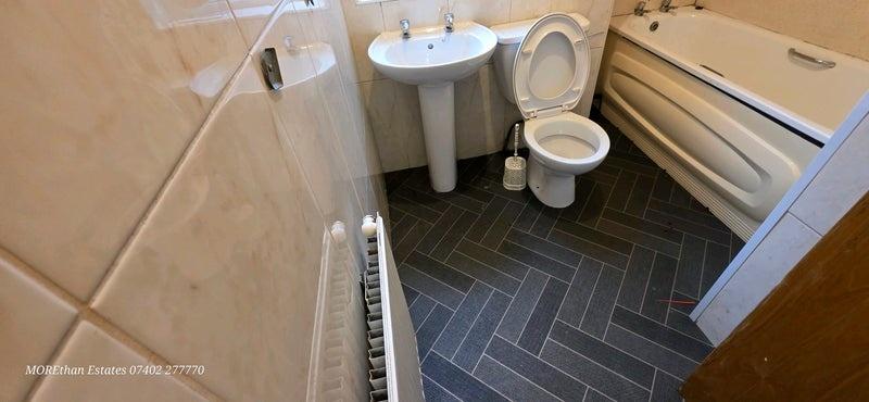 Neat, well-maintained bathroom with a full bath...