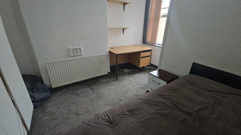 Well-presented bedroom with a comfortable bed, ...